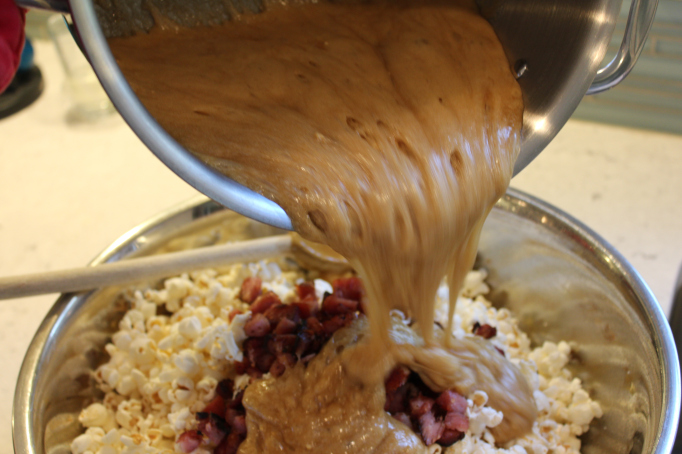 pouring caramel over bacon and popcorn