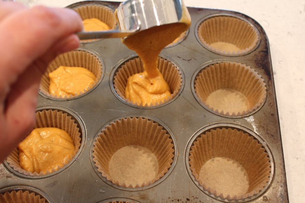 pumpkin muffin batter in cups